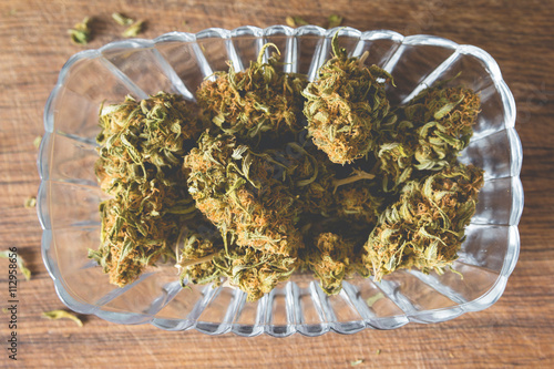 Marijuana buds in the glass plate photo