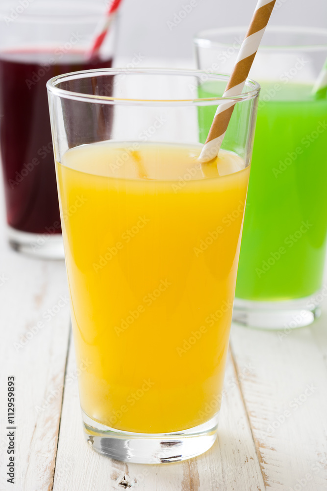 Fresh fruit smoothies on a white wooden background
Fresh fruit smoothies on a white wooden background
