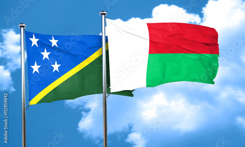 Solomon islands flag with Madagascar flag, 3D rendering