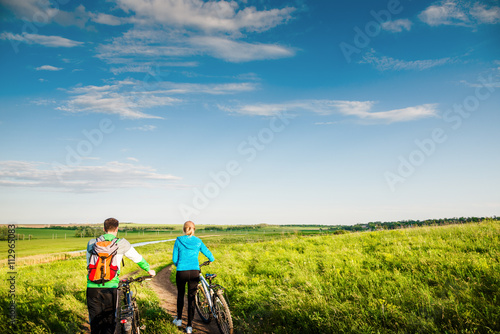 couple cycling outdoors