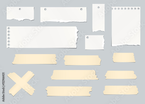 Pieces of ripped white blank note paper, masking tapes are stuck on gray background