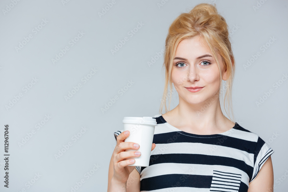 Beautiful young woman drinking coffee to go Beautiful young woman drinking coffee to go