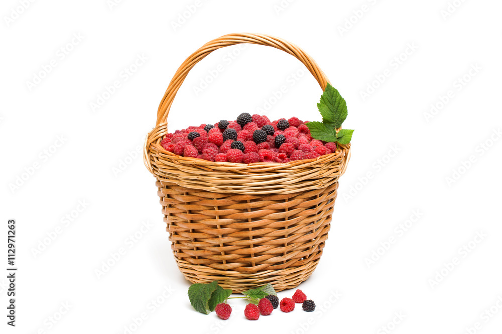 Fresh ripe red raspberries in a wicker bowl Fresh ripe red raspberries in a wicker bowl
