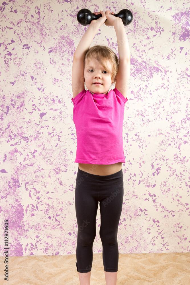 cute little girl with dump bell cute little girl with dump bell