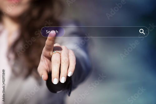 Woman surfing the internet by pressing search button on browser tab on virtual touch screen.