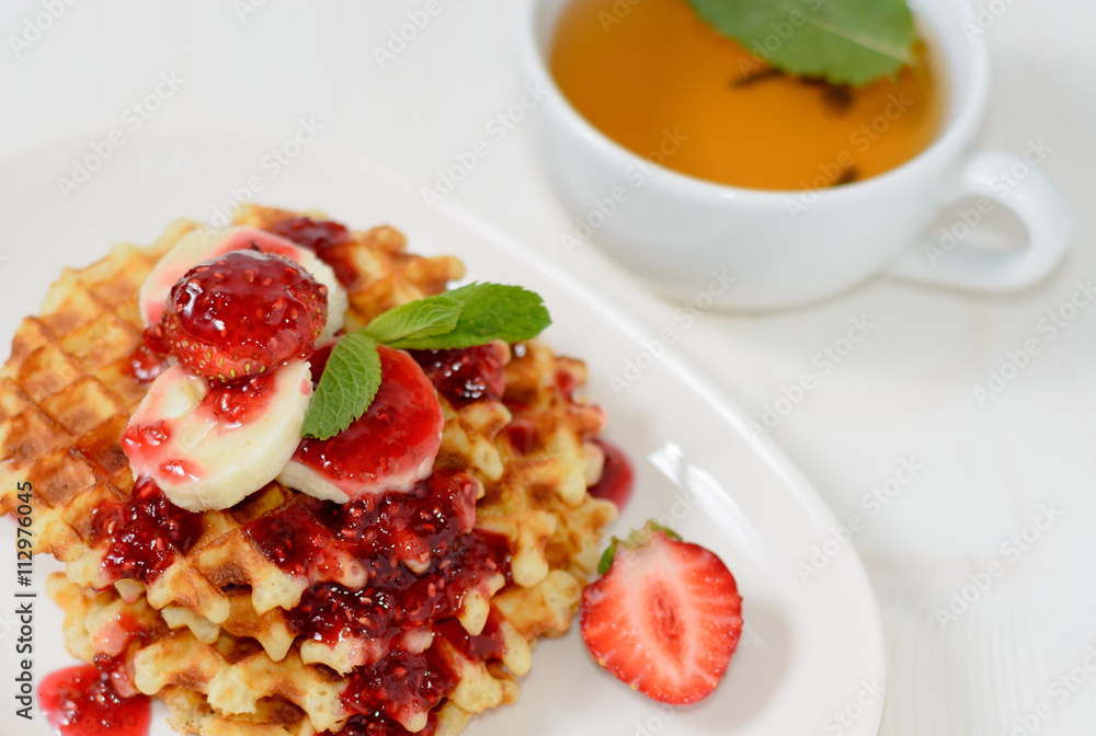 belgium waffles with strawberries, mint and raspberry jam belgium waffles with strawberries, mint and raspberry jam
