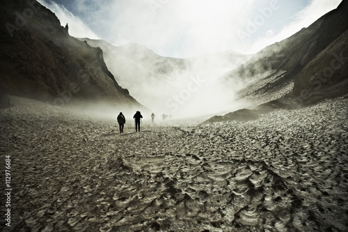 Hikers trekking through the Mutnovsky Volcano photo