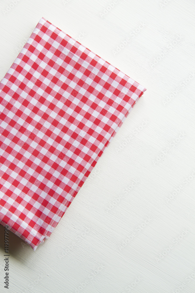 Red towel over wooden kitchen table. View from above with copy s Red towel over wooden kitchen table. View from above with copy s