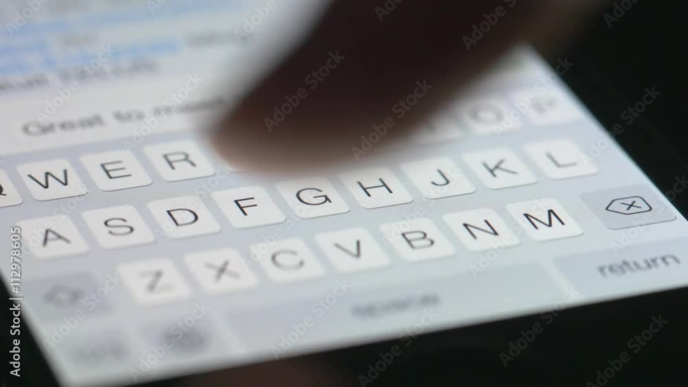 Finger texting or typing on a touchscreen smartphone in the darkness. Finger texting or typing on a touchscreen smartphone in the darkness.