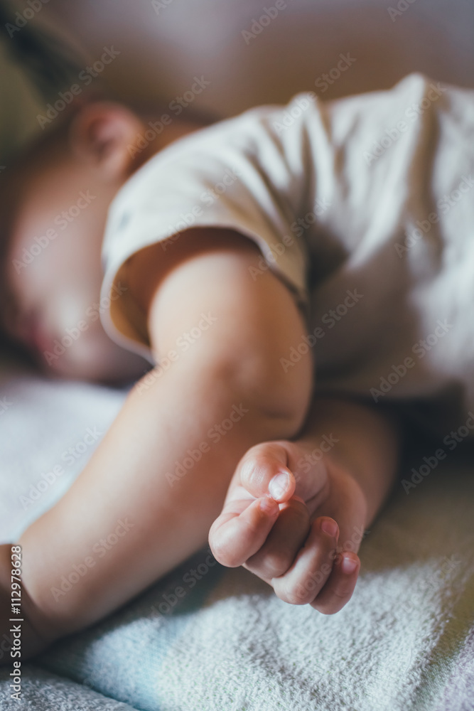 small child sleeps soundly during the day. Close-up small child sleeps soundly during the day. Close-up