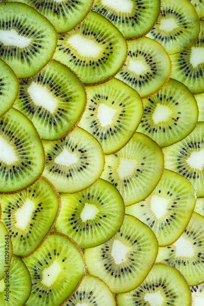 fresh kiwifruit background. round slices closeup fresh kiwifruit background. round slices closeup