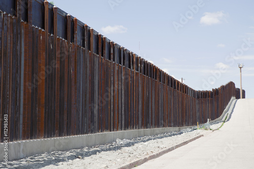 Barrier fence in Nogales, Arizona photo