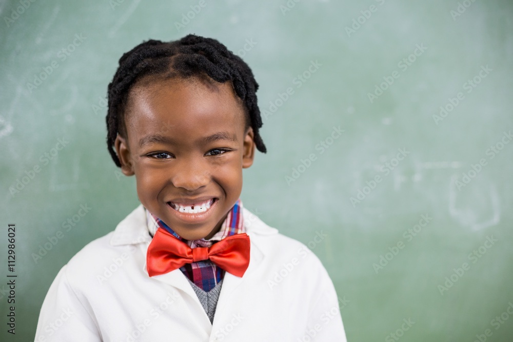 Portrait of happy schoolboy smiling in classroom Portrait of happy schoolboy smiling in classroom