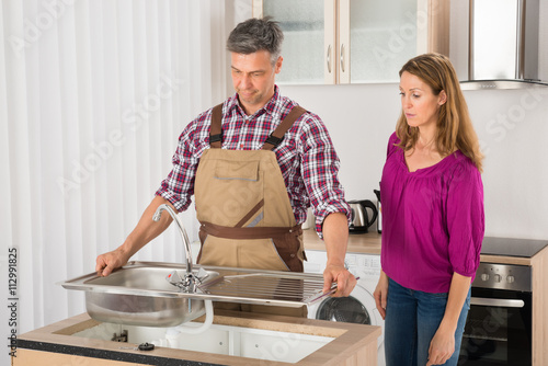 Plumber Fixing Stainless Steel Sink