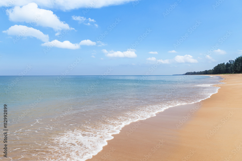 tropical beach and sea with white cloud and blue sky background in  Thailand