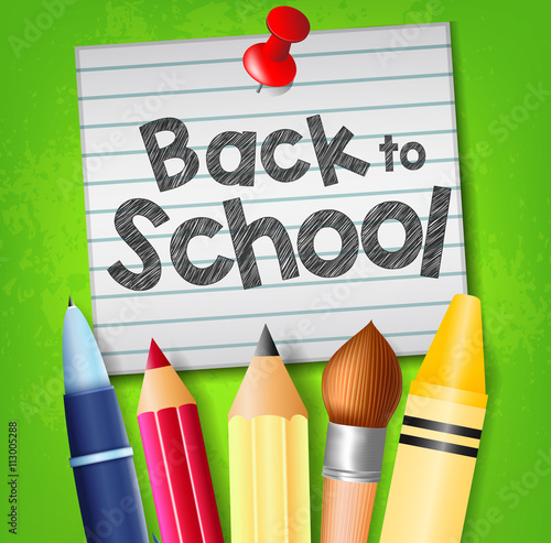 Back to School Text on Pinned Piece of Paper with School Supplies on Green Background
