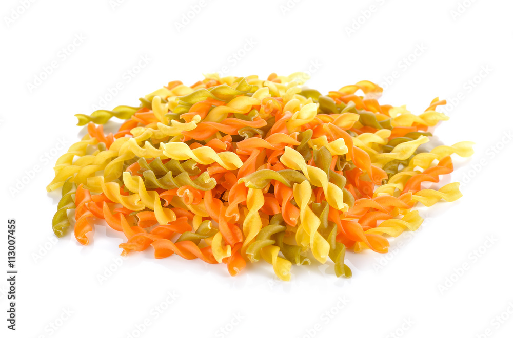 pile of small vegeroni Rotini spirals pasta on white background