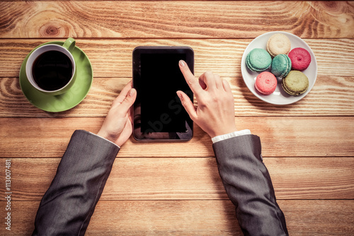 Businesswoman having coffee break photo