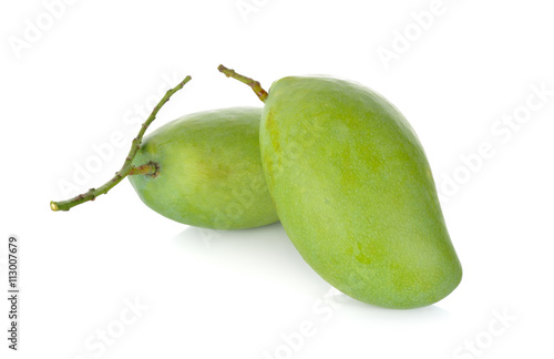 raw green mango with stem on white background