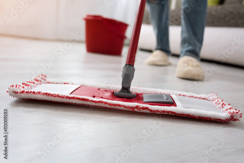 Closeup cleaning mopping floor photo