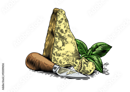 Pieces of hard cheese with cheese knife and green basil