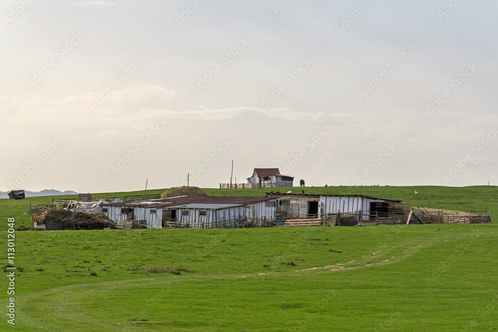 A sheepfold atop of the hill in Transylvania A sheepfold atop of the hill in Transylvania