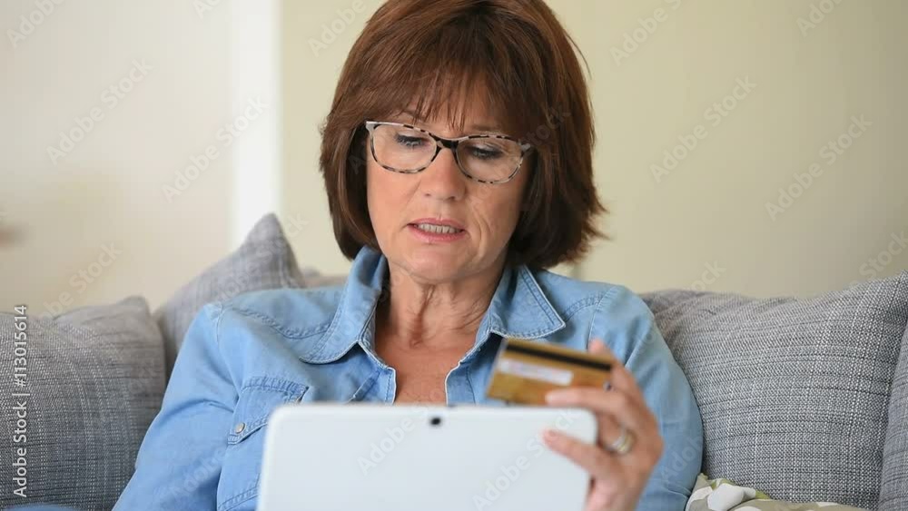 Senior woman shopping online with tablet Senior woman shopping online with tablet