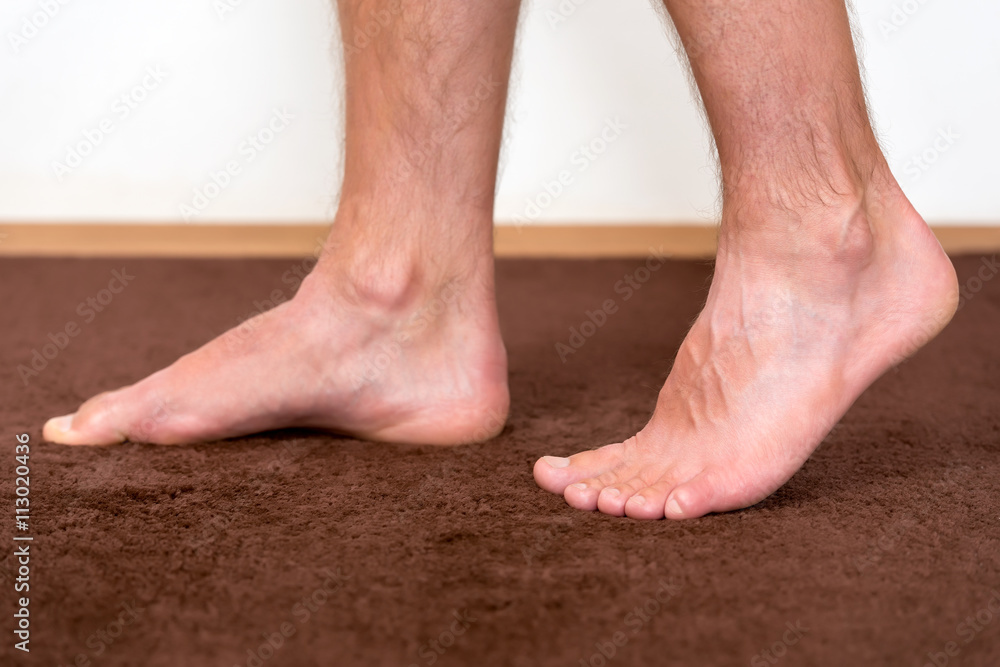 Healthy male feet feeling comfortable at home. Healthy male feet feeling comfortable at home.