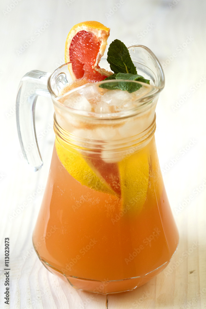 Grapefruit lemonade in jag with fruit Grapefruit lemonade in jag with fruit