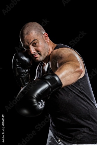 Boxer performing a right hook  © WavebreakmediaMicro