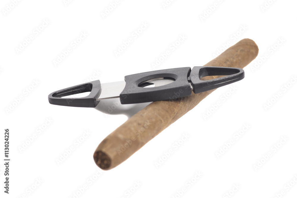 Cuban cigar and a cutter isolated on white background Cuban cigar and a cutter isolated on white background