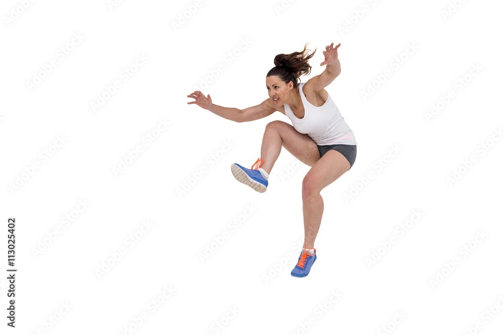 Athletic woman running on white background