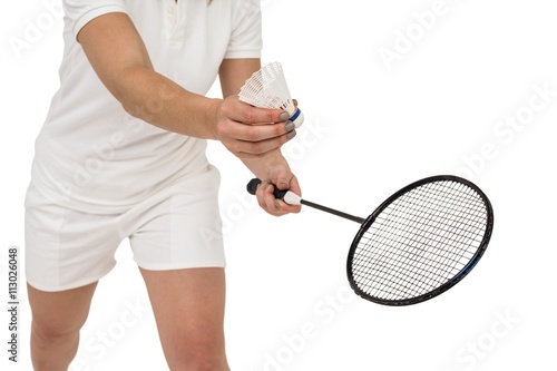 Female athlete holding a badminton racquet ready to serve © WavebreakmediaMicro