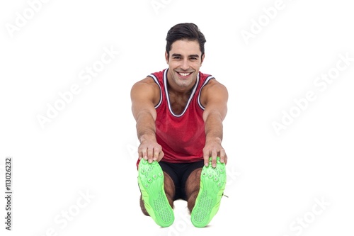 Portrait of male athlete doing stretching exercise