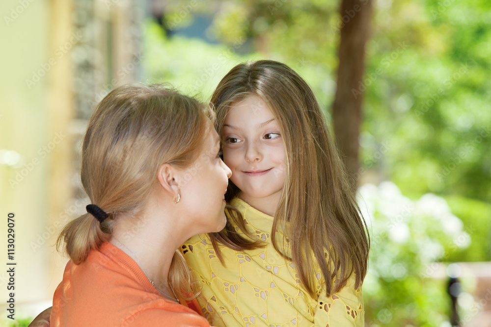 portrait of happy mother with daughter having good time in summer environment portrait of happy mother with daughter having good time in summer environment