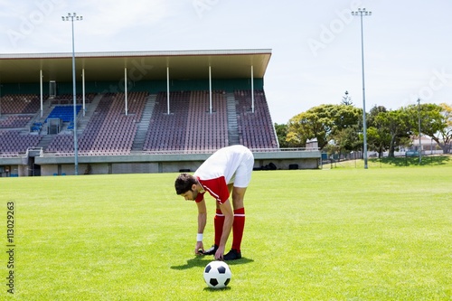 Football player warming up in stadium © WavebreakMediaMicro