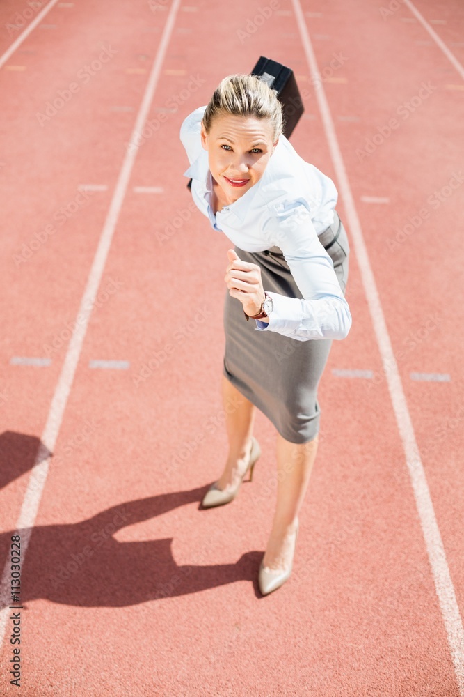 Portrait of businesswoman in ready to run position Portrait of businesswoman in ready to run position