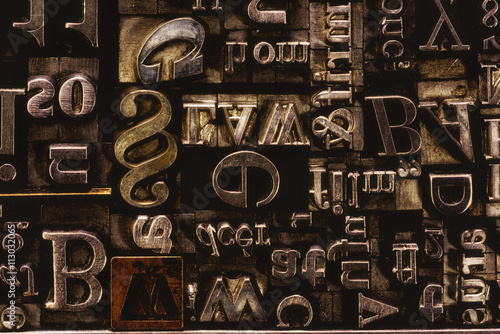 Metal Letterpress Types.
A background from many historic typographical letters in black and white with white background.