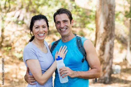 Portrait of a couple smiling and holding each other