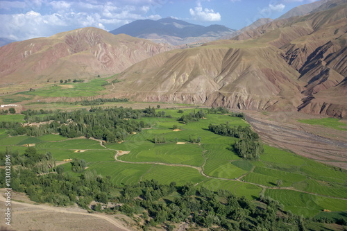 Rice fields and terracing in a valley in the Shahrak region, Iran photo