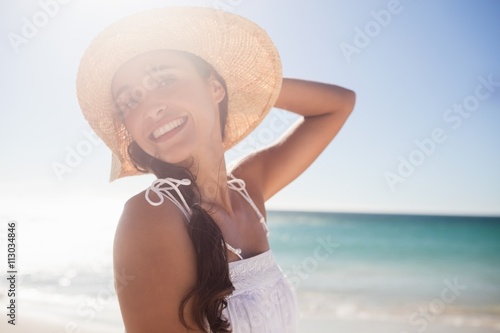 Happy woman posing on the beach