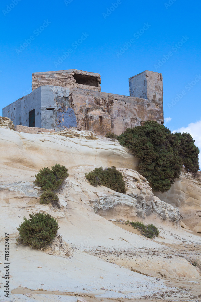 Coastal rocks and a building, island Malta
