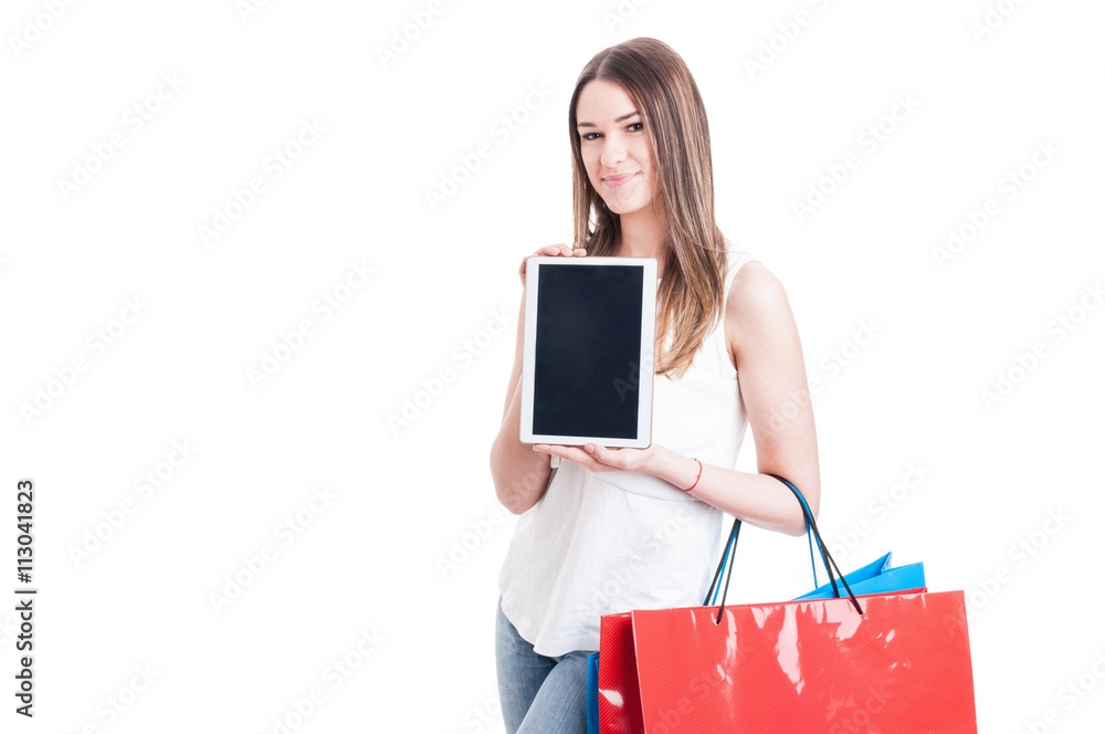 Shopaholic pretty girl holding modern tablet pc with blank scree Shopaholic pretty girl holding modern tablet pc with blank scree