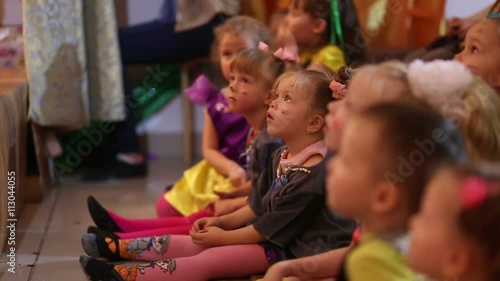 Young children watching a performance at the theater