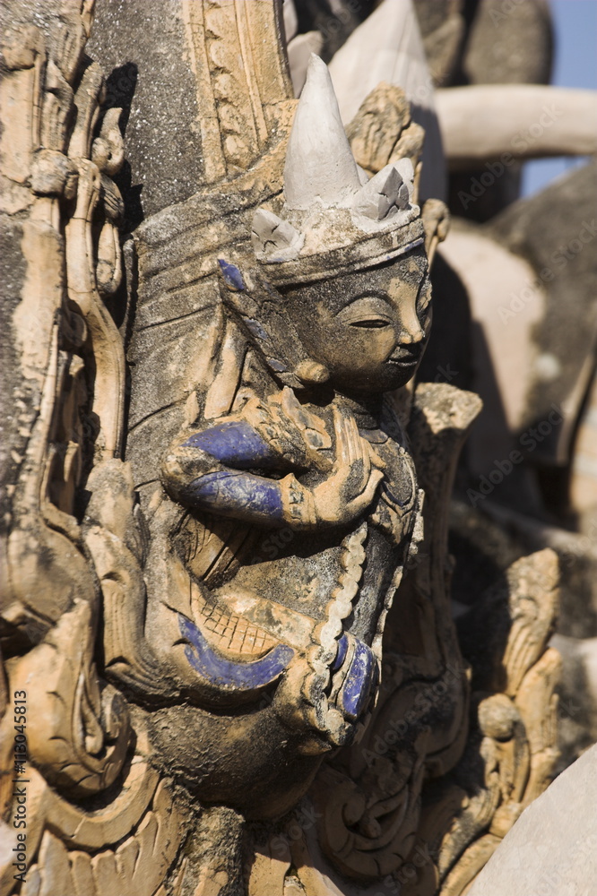 Figure carved in stucco decorates one of the ancient stupas, Kakku Buddhist Ruins, a site of over two thousand brick and laterite stupas, said to date back to the 12th century, Shan State Figure carved in stucco decorates one of the ancient stupas, Kakku Buddhist Ruins, a site of over two thousand brick and laterite stupas, said to date back to the 12th century, Shan State