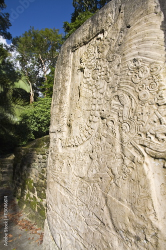 Stela 9 erected in AD 625 to commemorate the accession of Lord Smoking Shell in 608, shown in ceremonial regalia, Lamanai, Belize