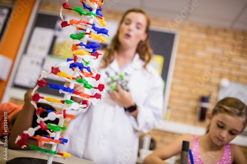 Teacher giving lesson to her students