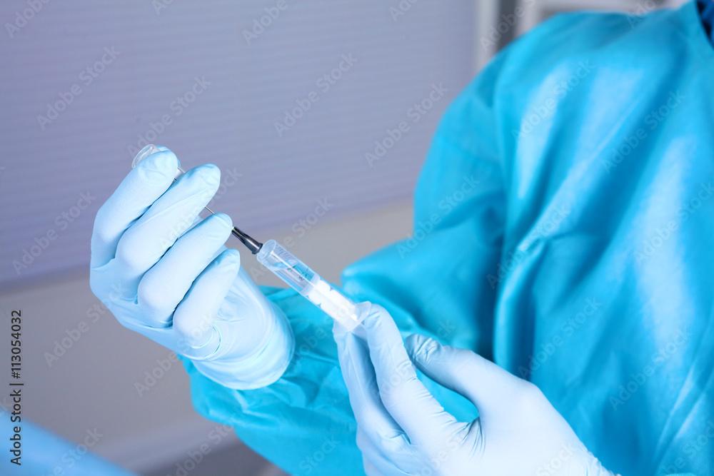 syringe in the hands of the doctor, close-up syringe in the hands of the doctor, close-up