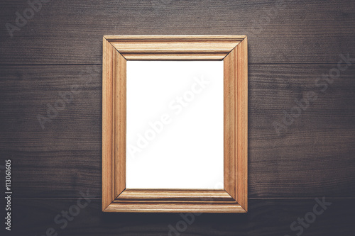 old empty frame with copy space on wooden wall