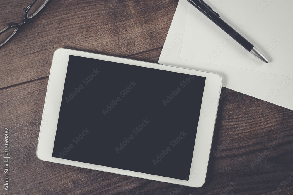 office table of businessman with tablet computer office table of businessman with tablet computer